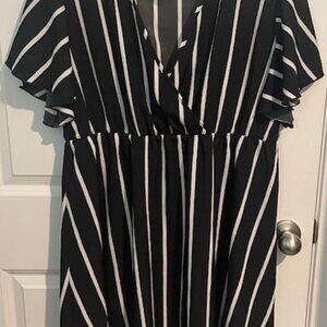 Fun and flirty, casual black and white horizontal stripe midi dress